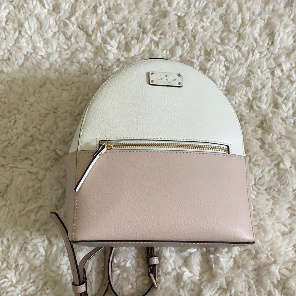 pink and white kate spade backpack